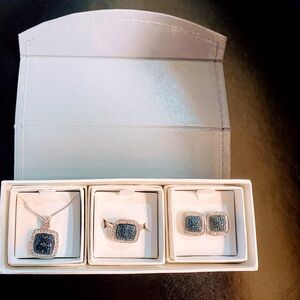 This set of Jewelry comes with a Necklace, matching ring & earrings.